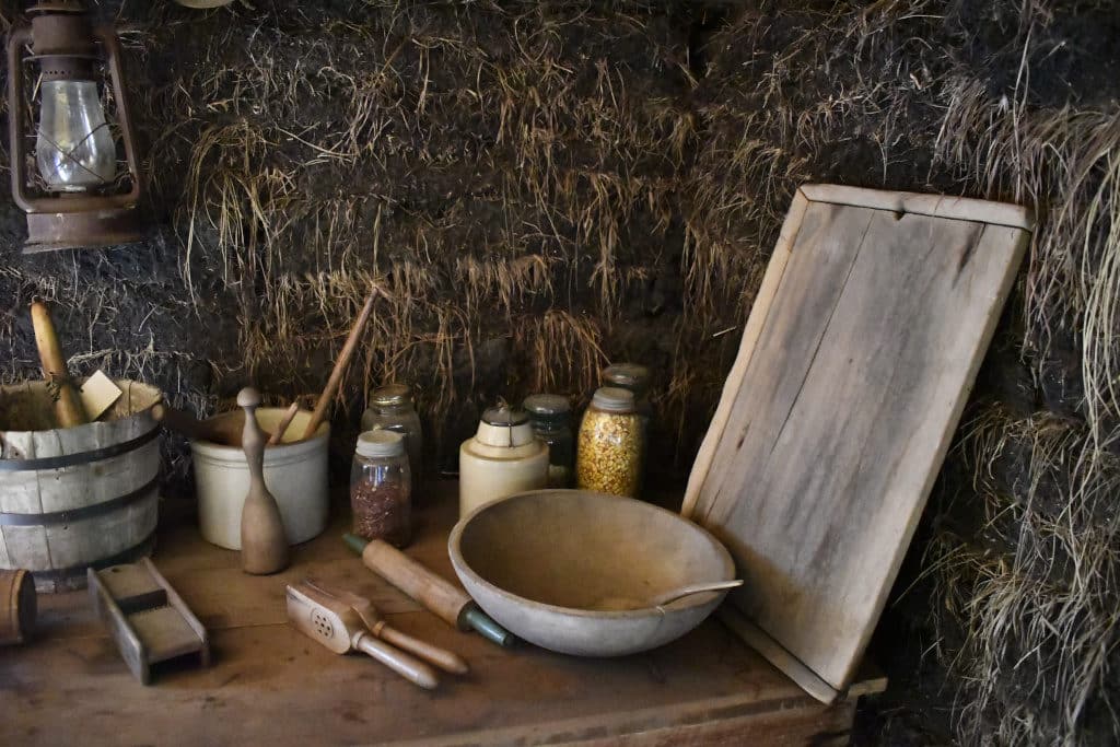 Period artifacts inside the sod house, cookware etc